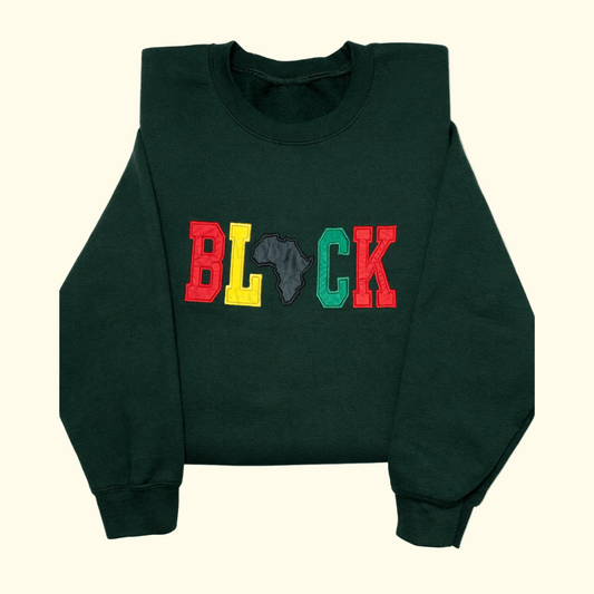 BLACK appliqué embroidered sweatshirt with colorful lettering and Africa silhouette on green crewneck