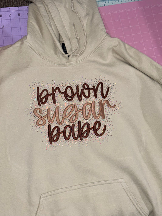 Embroidered sweatshirt with decorative design brown sugar babe with rhinestone detailing