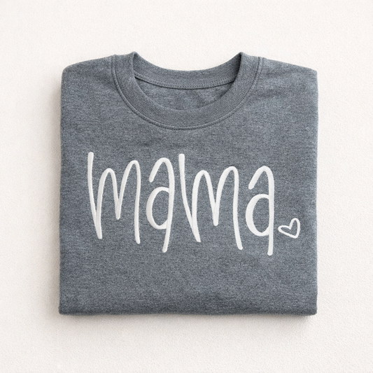 Folded gray sweatshirt with 'mama' printed on it against a white background