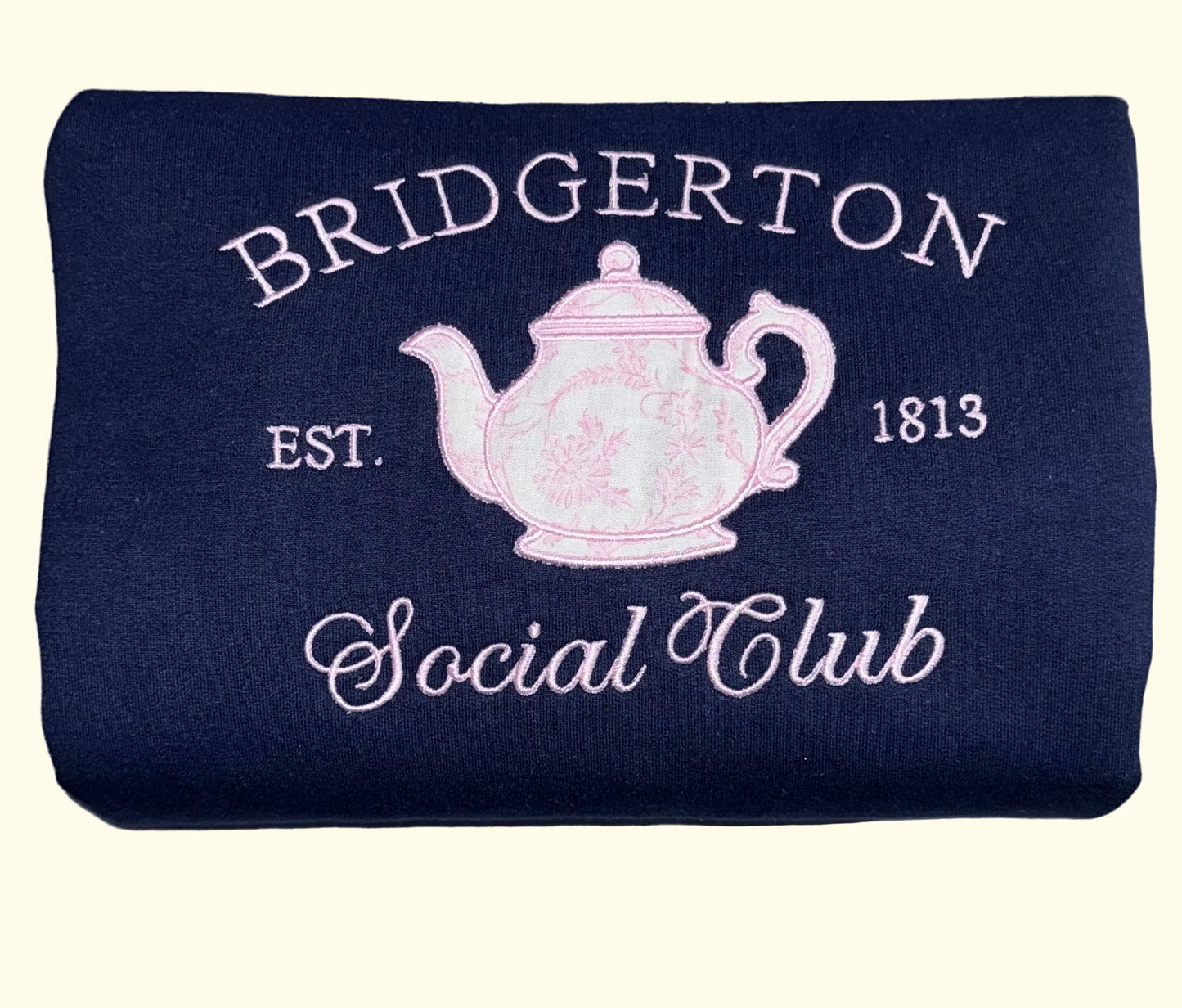 Navy blue sweatshirt regency romance inspired featuring a pink chinoiserie teapot.
