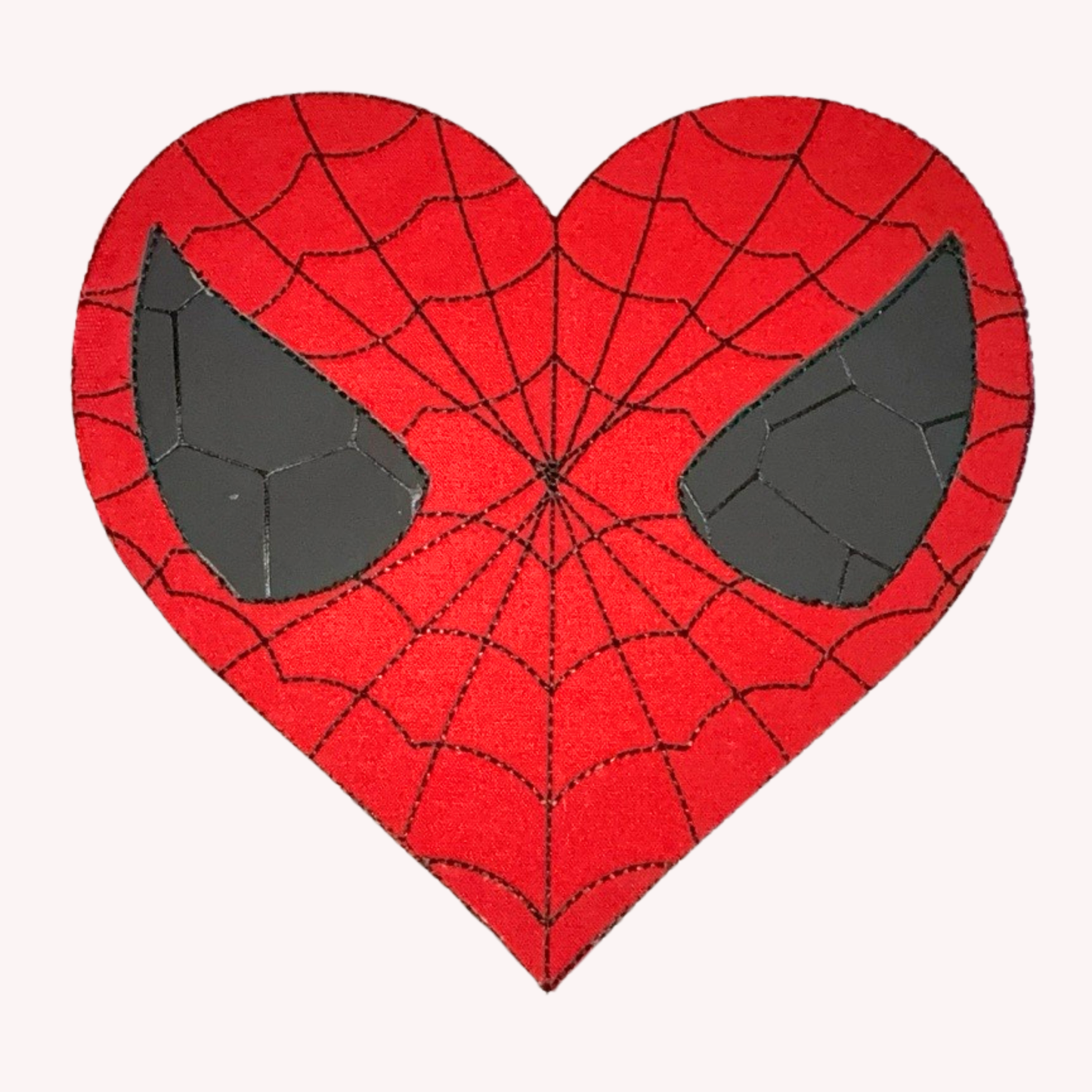 Heart-shaped patch with Spider-web design on a white background