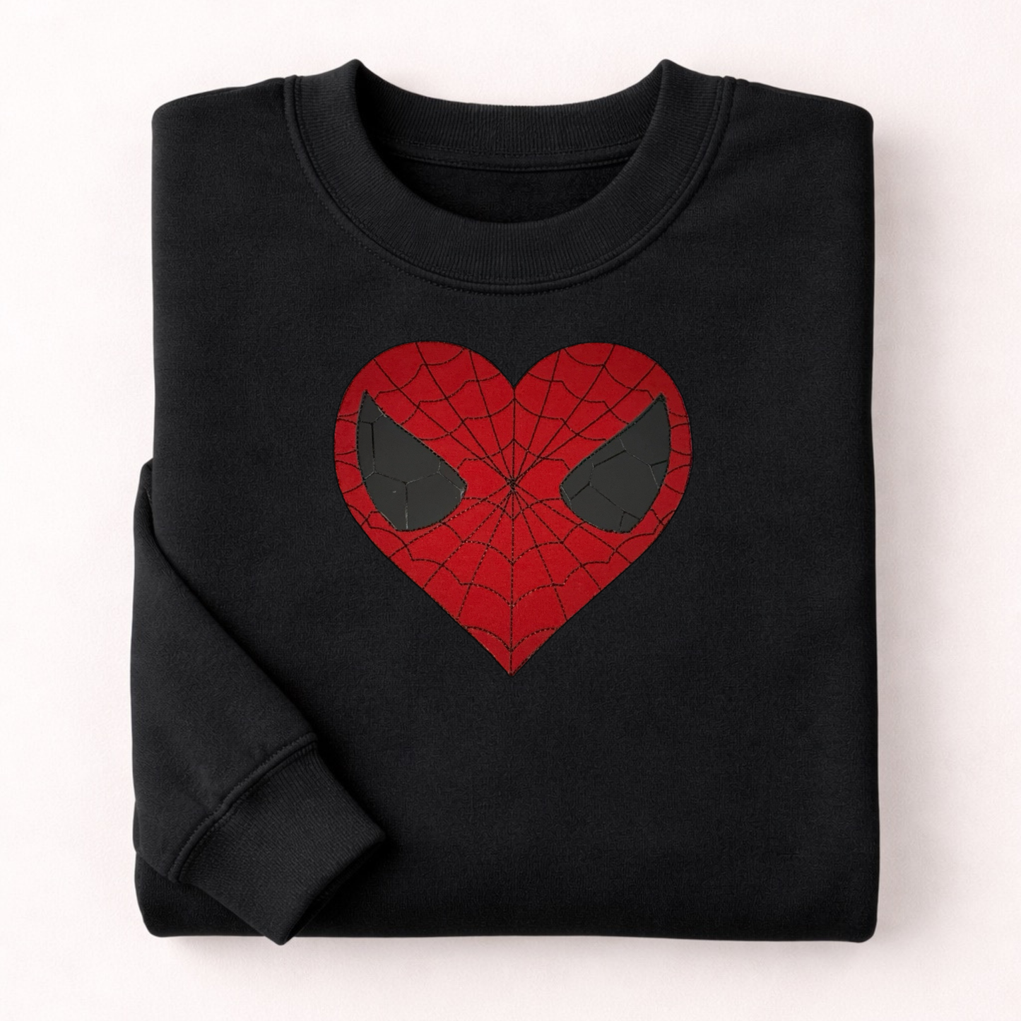 Black sweatshirt with a red heart-shaped spider web design on a white background