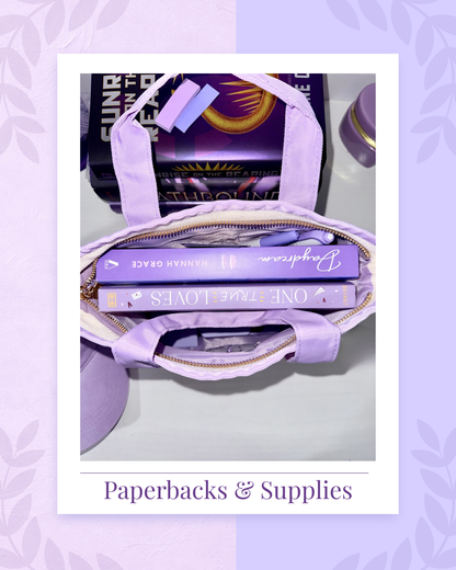 Purple tote bag with books and supplies on a matching purple background