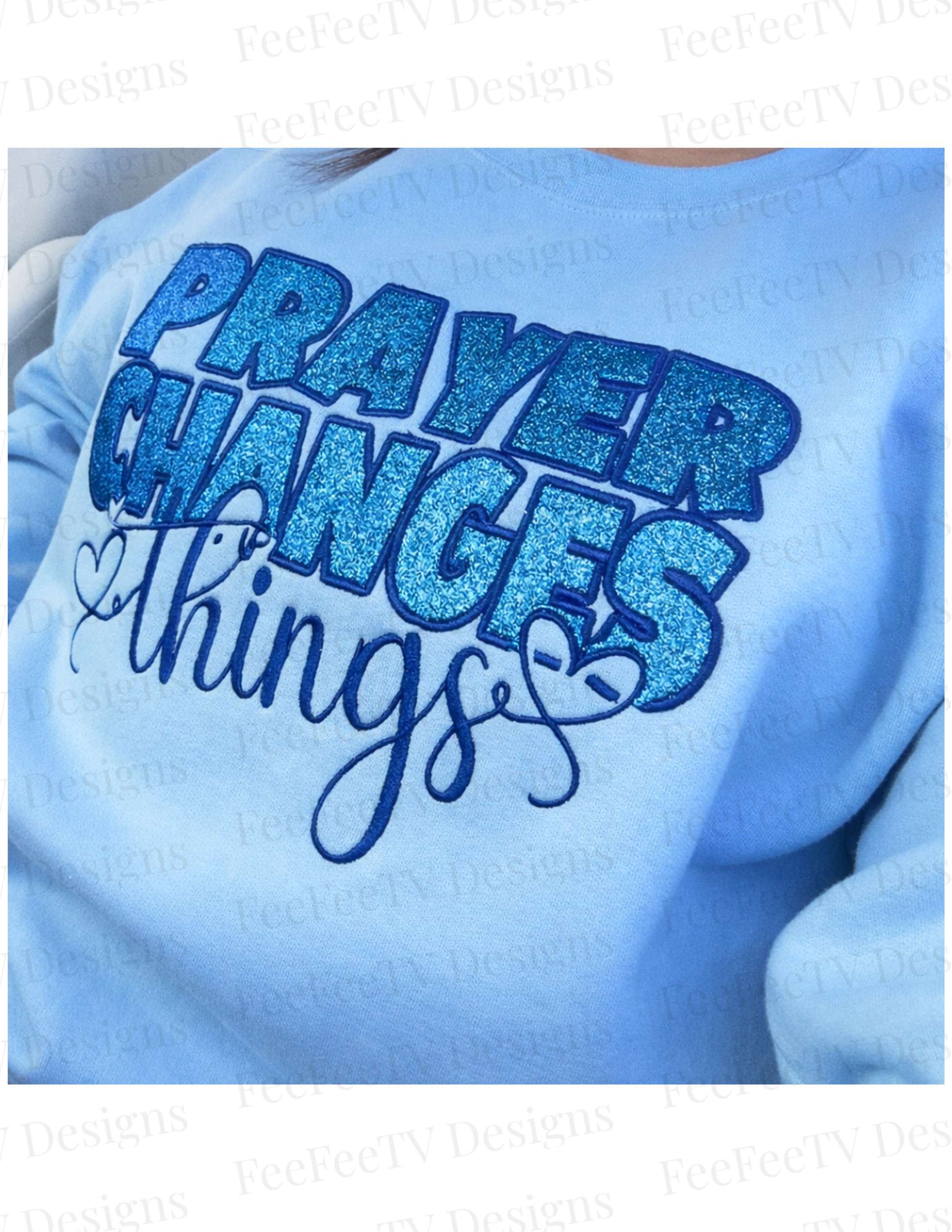 Light blue sweatshirt with 'PRAYER CHANGES THINGS' text in blue glittery letters.