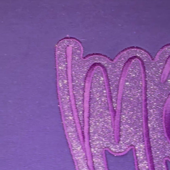 closeup video of embroidered mama and glitter htv sweatshirt