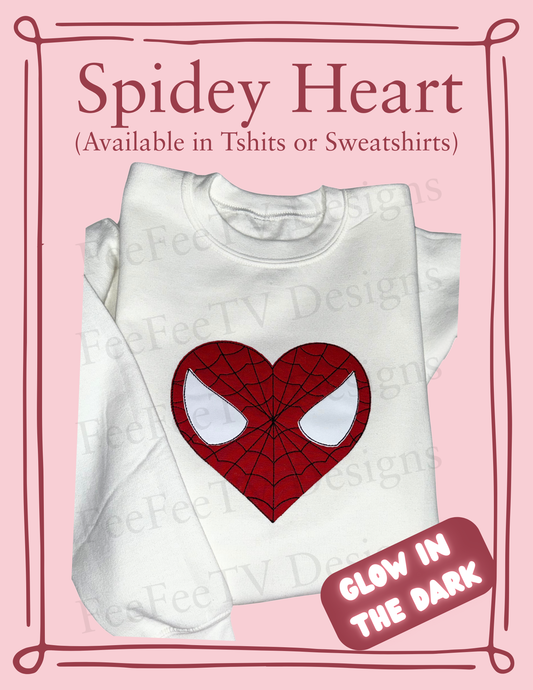 Folded white embroidered sweatshirt with red heart-shaped Spider design with white glow in the dark eyes on a white background